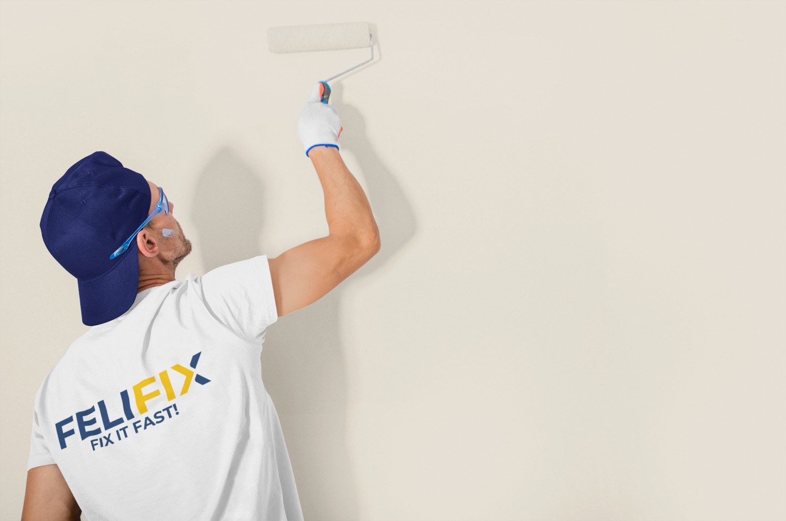 FeliFix painter refreshing an interior wall